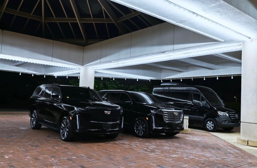 Escalade ESV and Sprinter at night