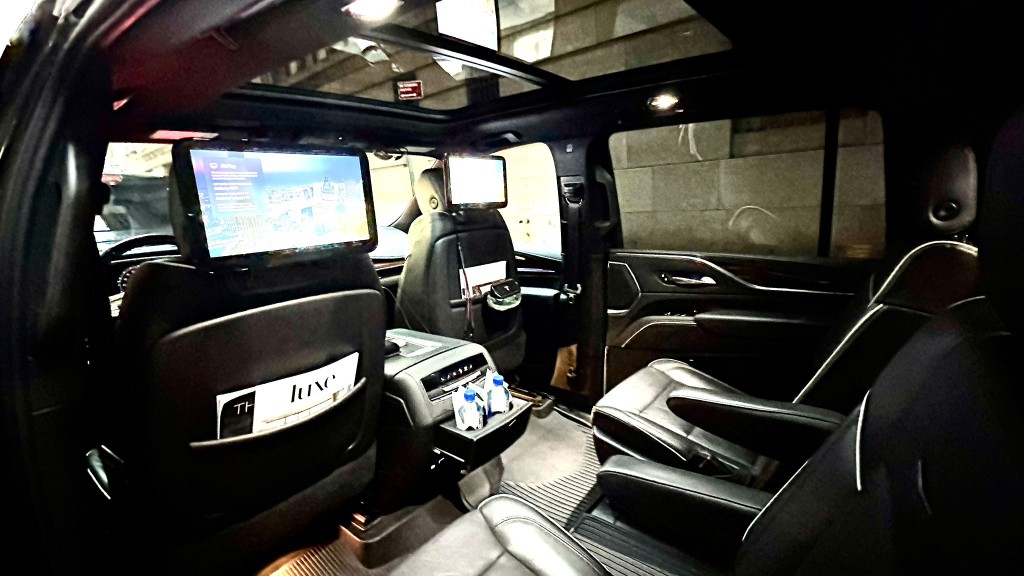 Escalade cabin — screens, captain chairs